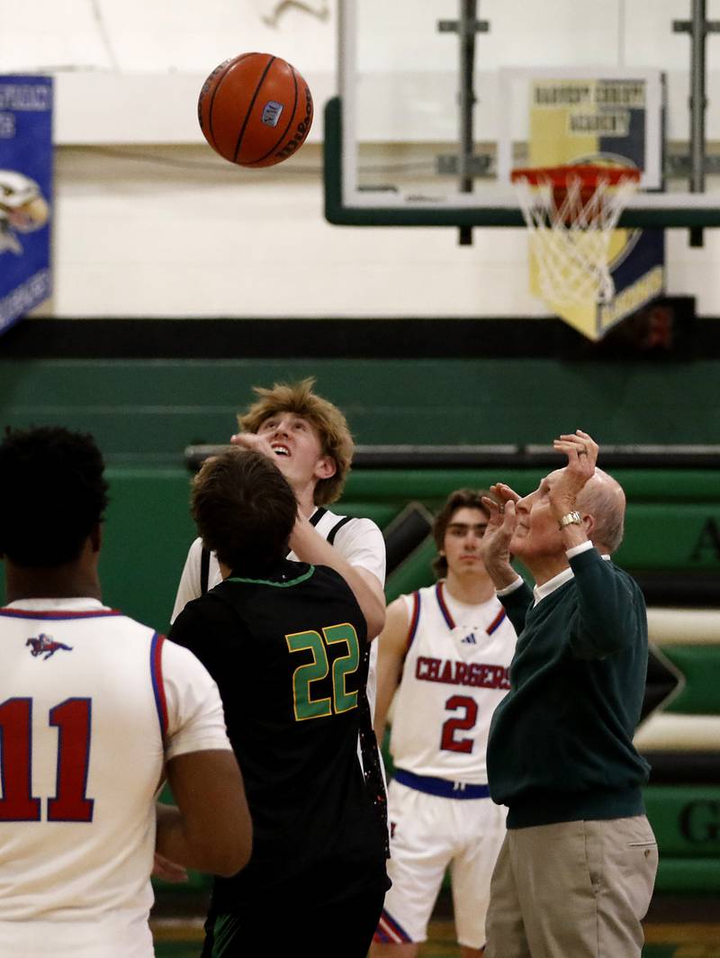 Alden-Hebron’s  Phil Judson a member of the schools 1952 boys basketball state championship team, tosses up the jump ball to start the  boy’s game of McHenry County Area All-Star Basketball Extravaganza on Sunday, April 13, 2025, at Alden-Hebron’s Tigard Gymnasium in Hebron.
