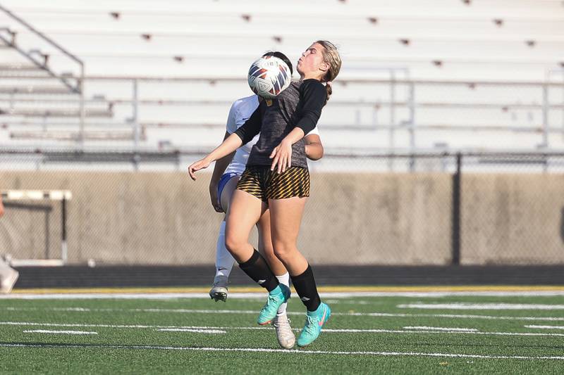 Joliet West’s Sophia Podmolik receives the pass against Joliet Central on Tuesday, April 30, 2024.