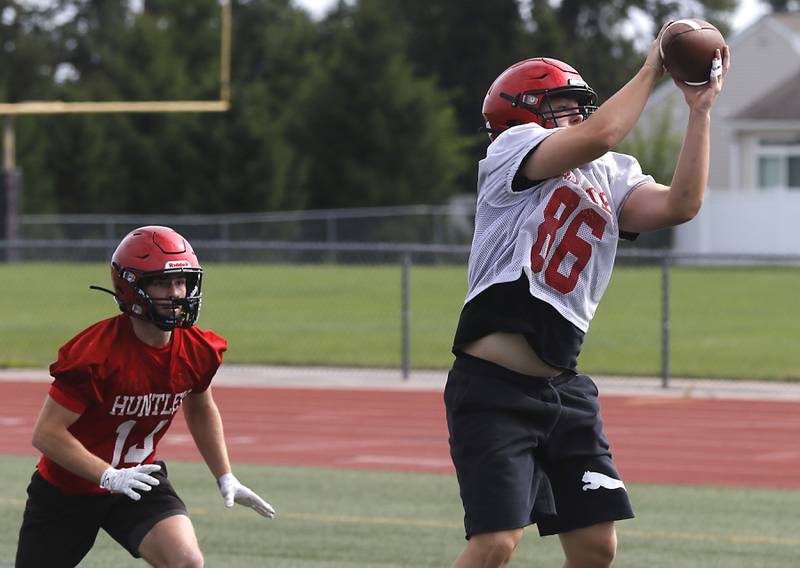 Huntley's Haiden Janke catches a pass during the first day of football practice Monday, August 7, 2023, at the Huntley High School’s Red Raider Stadium.