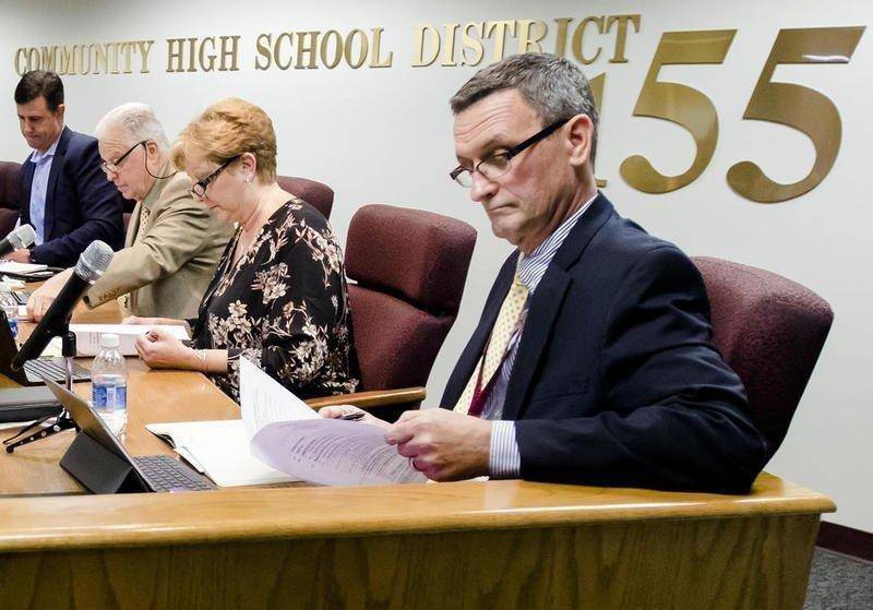 Crystal Lake-based Community High School District 155 Superintendent Steve Olson looks through papers during a board meeting in November 2017 in Crystal Lake.