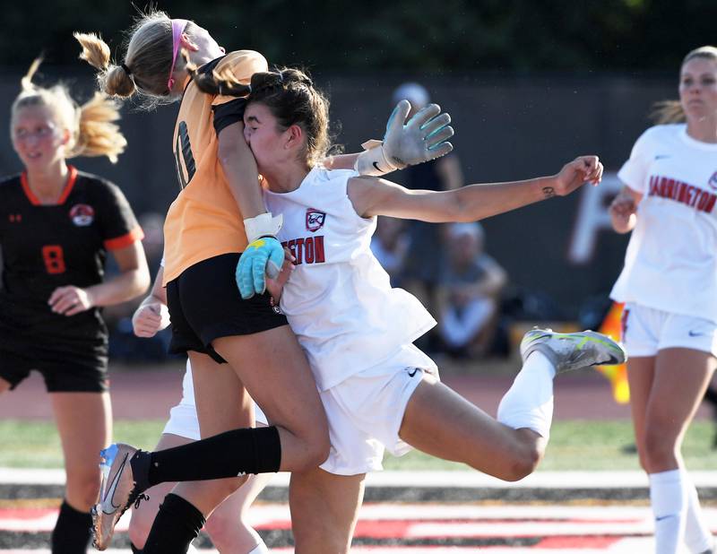 Barrington’s Sarah Sarnowski collides with Libertyville goalkeeper Kaate Hopma after scoring a goal in the IHSA girls Class 3A state soccer semifinal game at North Central College in Naperville on Friday, June 2, 2023.