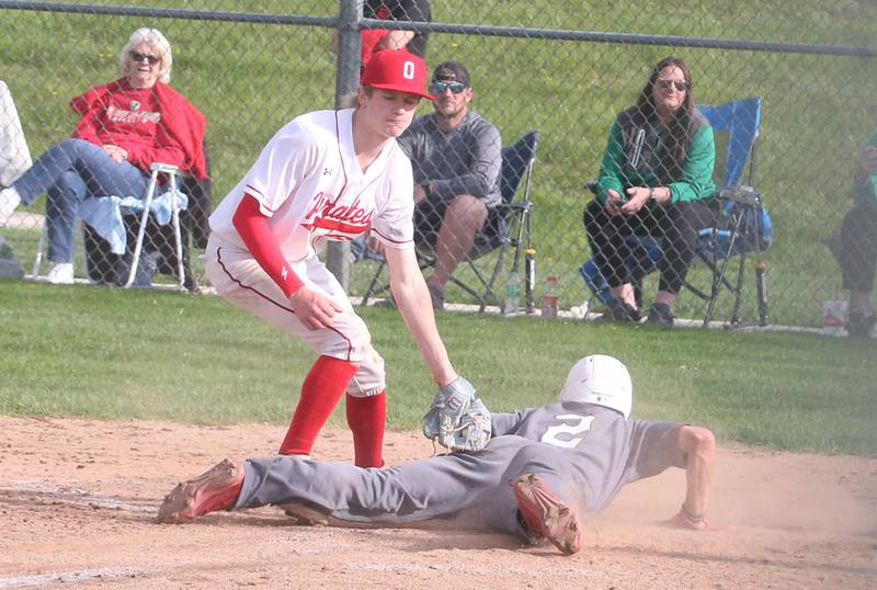 Ottawa pitcher George Shumway misses the tag on L-P's Gavin Kallis while stealing home on a wild pitch on Friday, May 2, 2025 at Ottawa High School.