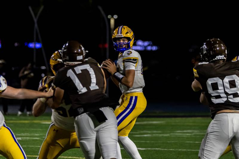 Lyons Township's Jack Slightom looks for an opening during a varsity football game against Joliet Catholic at Busey Bank Field at Joliet Memorial Stadium on Aug. 29, 2025.