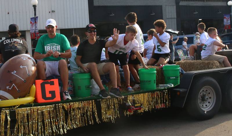 The Irish flag football team rides during the Homecoming parade on Thursday, Sept. 18, 2025 downtown Spring Valley.