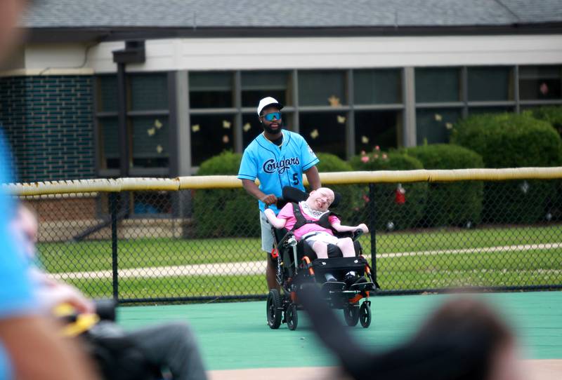 Kane County Cougars outfielder Trendon Craig partners with Marklund client Jimmy M. during a softball game at Marklund Hyde Center in Geneva on Tuesday, July 9, 2024.