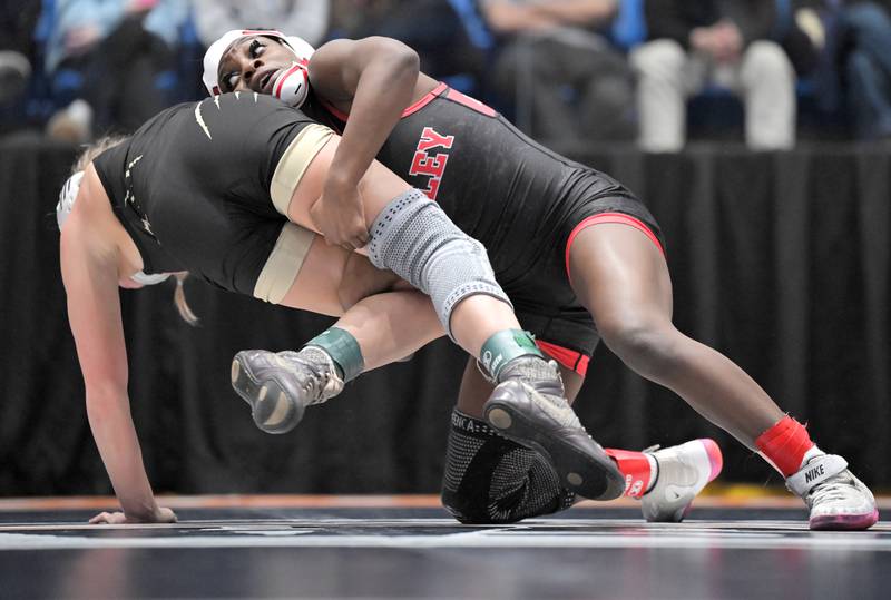 Huntley’s Janiah Slaughter throws Oak Forest’s Alexandra Sebek in the 100-pound class at the girls wrestling state finals tournament at Grossinger Arena in Bloomington on Saturday, Feb. 28, 2026.