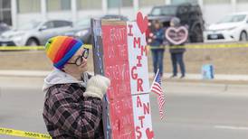 Sauk Valley group swaps anger for love on Valentine’s Day at rally against Trump administration policies