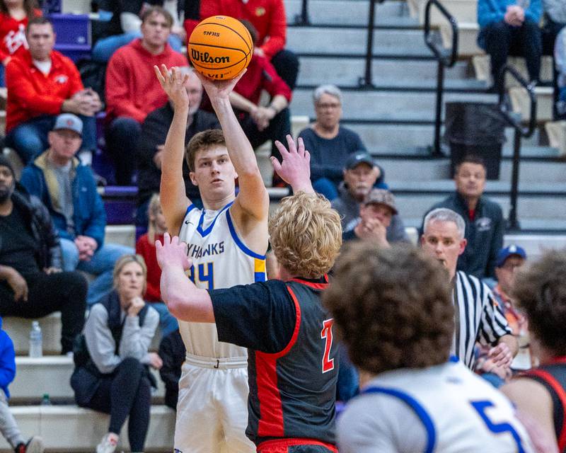Danny Loud (34) of Johnsburg shoots 3-pointer over Aurora Christian's Asa Johnson during the Class 2A Boys Sectional Basketball tournament game on Wednesday, March 4, 2026 at Mendota High School.