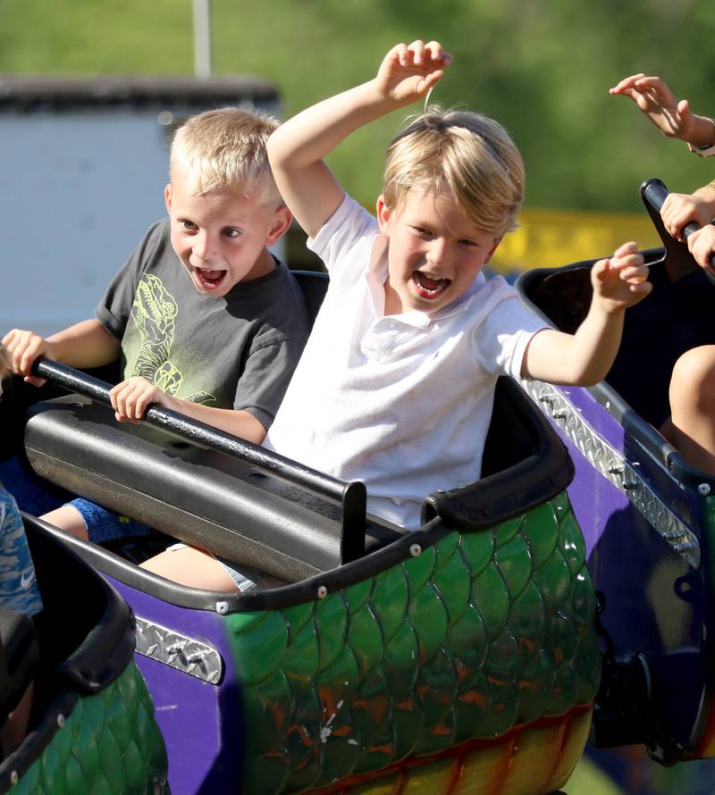 Christian King, left, and Hudson Everard, both 5, enjoy a ride on the roller coaster during the annual Lakeside Festival at the Dole and Lakeside Arts Park on Thursday, July 1, 2021, in Crystal Lake.