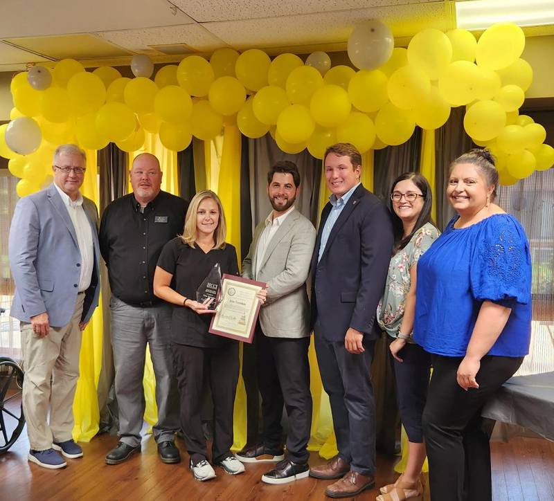 Erin Tremble, third from left, receives the
Health Care Council of Illinois’ Long-Term Care Hero Award on Tuesday from Cole Teller, Omni Health Care, Citadel. Also pictured, from left, are Matthew Pickering, HCCI; Mike McMahon, Citadel;
State Rep. Brad Fritts; Sterling Mayor Diana Merdian; and Lindsey Hess, HCCI.
