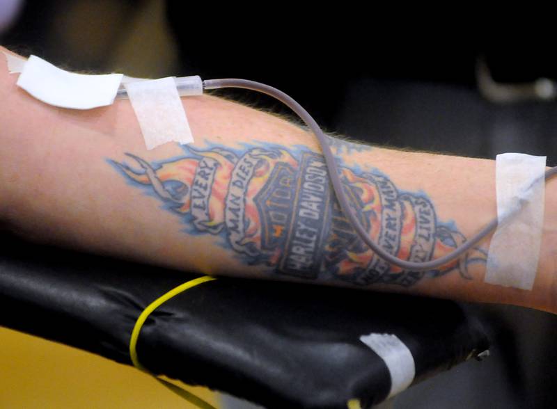 A firefighter donates blood during the third annual Jake Keltner Memorial Blue Blood Drive on Law Enforcement Appreciation Day, Sunday, Jan. 9, 2022, at the Sage YMCA. McHenry County sheriff's Deputy Jacob Keltner was killed in the line of duty serving an arrest warrant in March 2019 in Rockford. All 230 appointments to donate blood were filled this year.