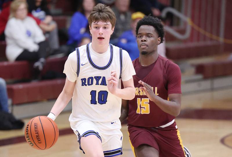 Hinckley-Big Rock's Max Hintzsche pushes the ball ahead of Chicago Marshall's Jalin Jackson Wednesday, March 1, 2023, during their Class 1A sectional semifinal matchup at Elgin High School.