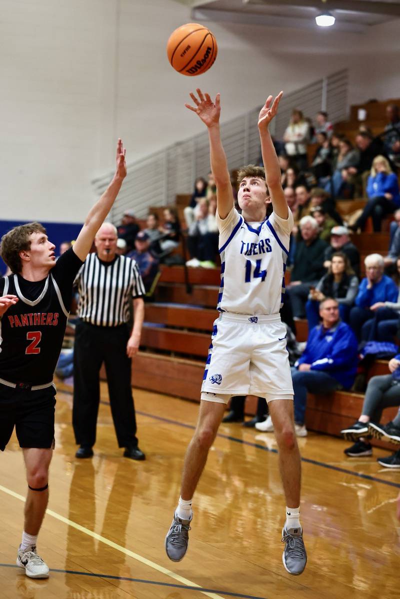 Princeton senior Jackson Mason shoots over Erie-Prophetstown's Connor Keegan in Tuesday's game at Prouty Gym. The visiting Panthers won 54-46.