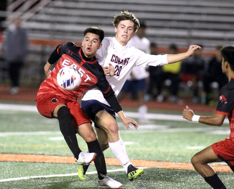 Glenbard East’s Edgar Duenas (left) and Conant’s Carson Hagler go after the ball during a 3A St. Charles East Sectional semifinal on Wednesday, Oct. 26, 2022.