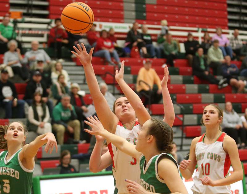 L-P's Emma Jereb lets go of a shot over Geneseo's Viola Pettit on Tuesday, Feb. 4, 2025 in AJ Sellett Gymnasium at L-P High School.