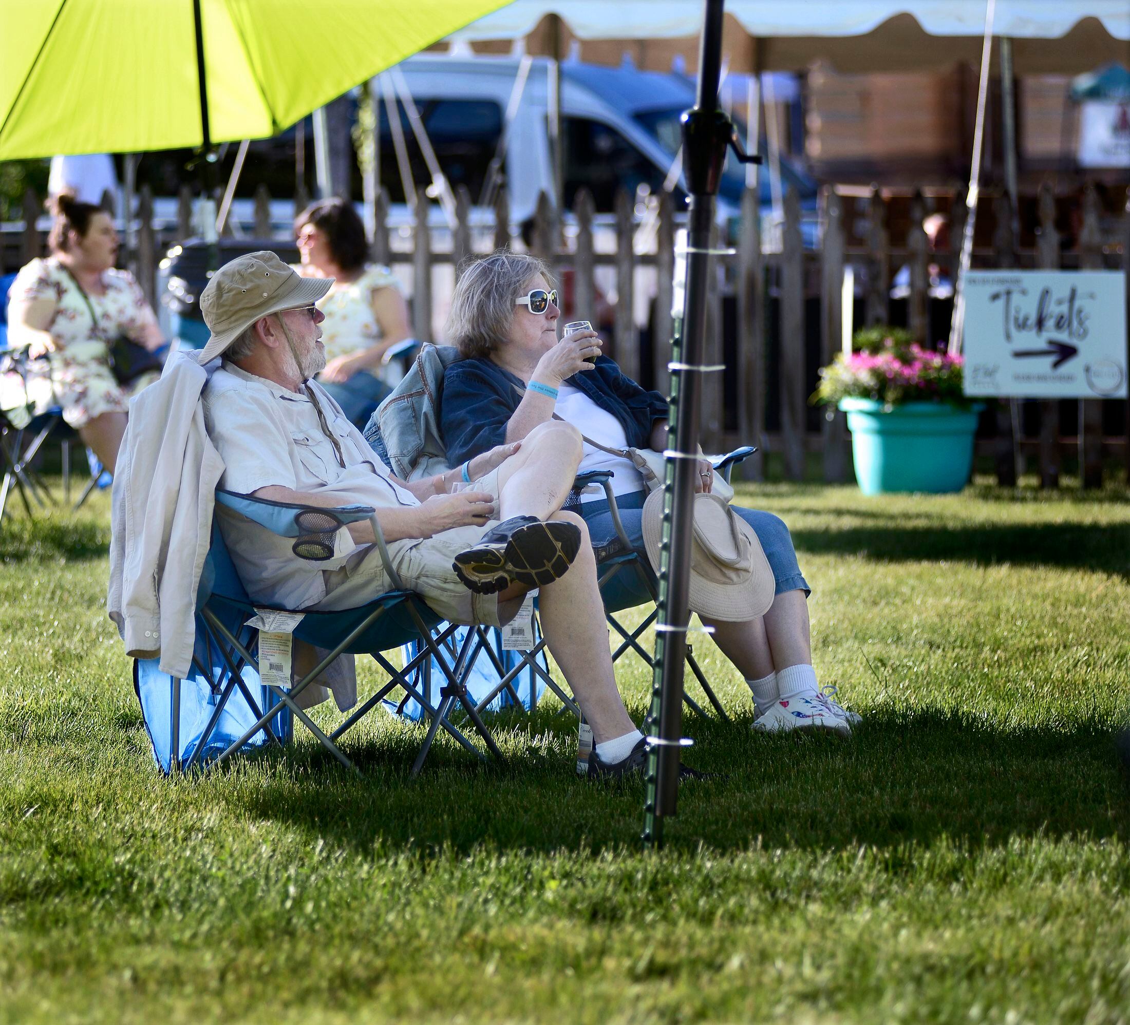 Fred and Debbie Kloese find a relaxing spot to enjoy their wine Friday, June 3, 2022, at Wine Fest in Ottawa. 