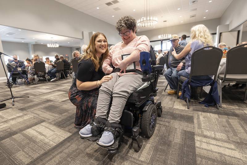 Maggie Hofsommer presents Kayla Baeza with the Suzy Hopper Miss Wheelchair Award Thursday, Oct. 16, 2025, during the annual Self Help Awards.