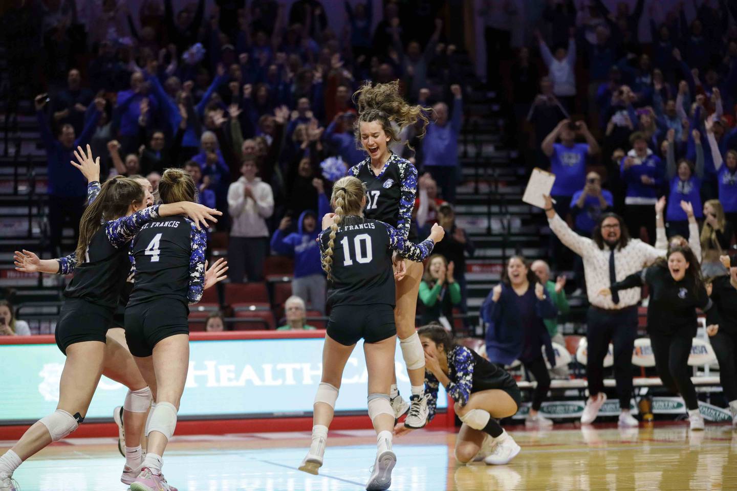 St. Francis celebrates after their win in the IHSA Class 3A girls volleyball state championship game between St. Francis and Nazareth Academy Saturday November 12, 2022 at Redbird Arena in Normal.