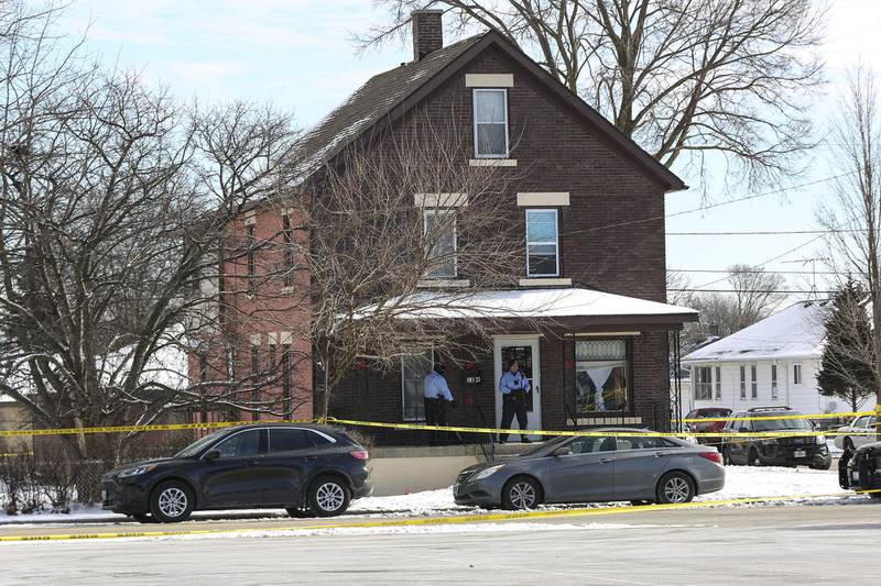 Police gather at the intersection of Ingalls Ave. and Nicholson St. after an officer involved shooting that took place on Thursday, Jan. 28, 2021, in Joliet, Ill.