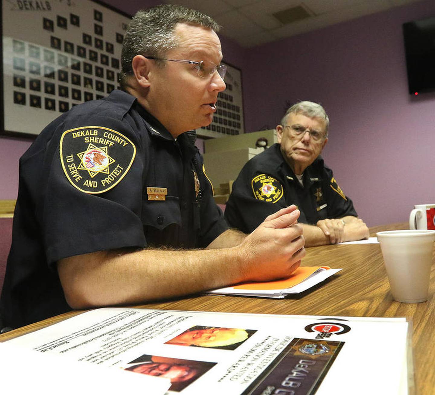 Shaw Local file photo – DeKalb County Chief Deputy Andy Sullivan (left) speaks to Shaw Local news reporters next to DeKalb County Sheriff Roger Scott (right) one year after police began a double homicide investigation after Patricia Wilson and Robert Wilson, of rural Sycamore, were found beaten to death Aug. 15, 2016, at their Old State Road home.