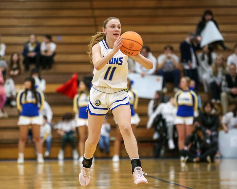 Lyon's Tess Bernson (11) passes during their Class 4A Lyons Sectional semifinal basketball game between Lyons vs Young. Feb 25, 2025 in La Grange.