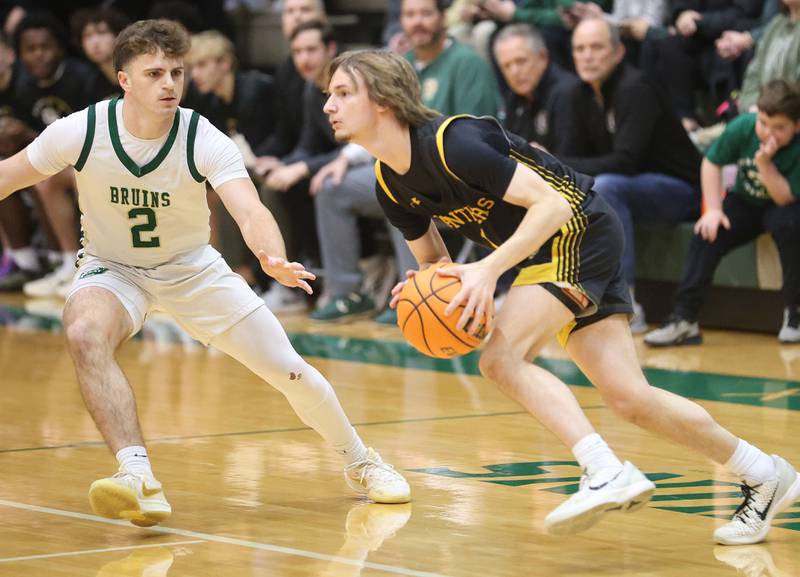 Putnam County's Jacob Furar looks to pass the ball around St. Bede's Gus Burr during the Class 1A Regional quarterfinal game on Monday, Feb. 23, 2026 at St. Bede Academy.