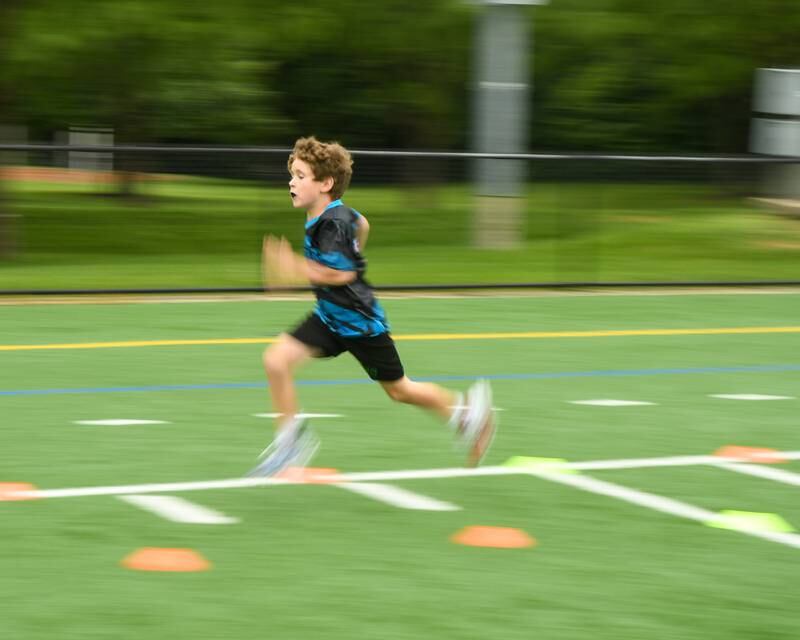 Connor McInerney, 7, of Downers Grove runs the 40 yard dash during the NFL Youth Flag Football Combine Day held at Doerhoefer Park in Downers Grove on Sunday Aug. 6, 2023.