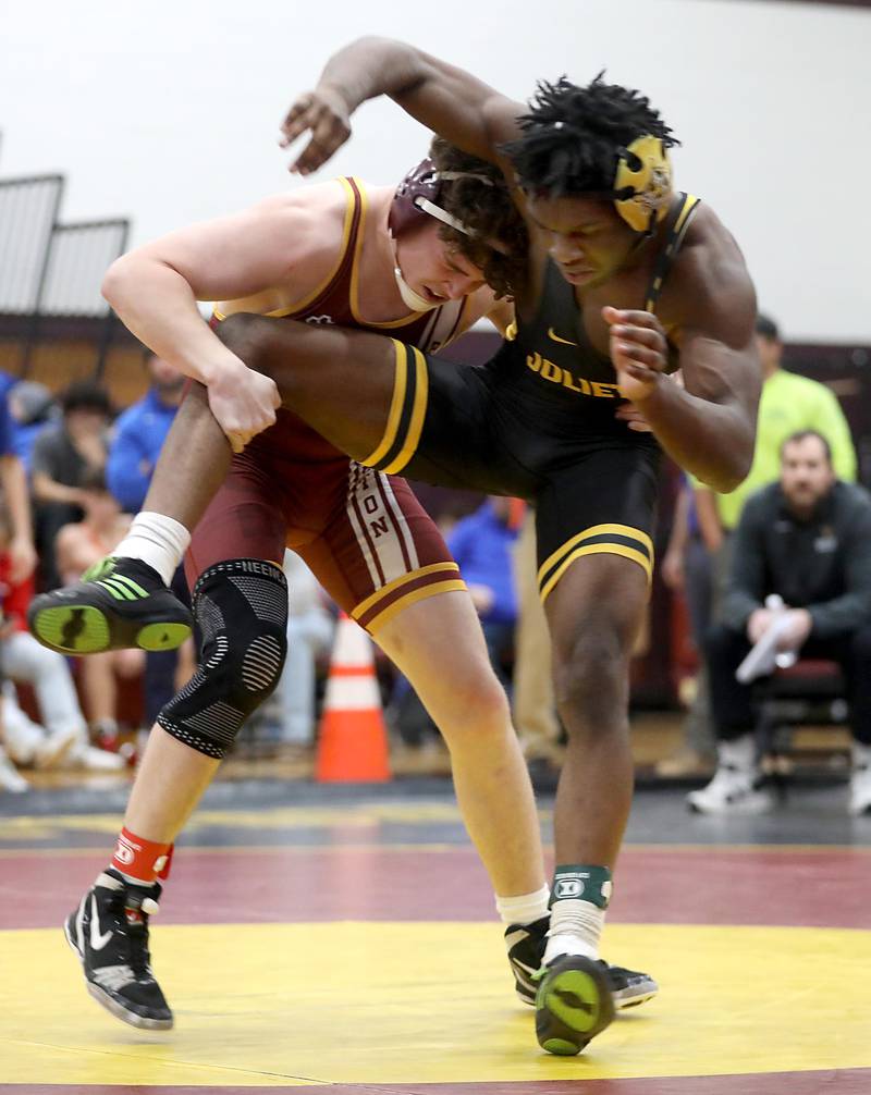 Richmond-Burton’s Max Martin takes down Joliet West’s Israel Booth during a 157-pound match in the Tom DuBois Invite wrestling meet on Saturday, Dec. 13, 2025, at Richmond-Burton High School in Richmond.