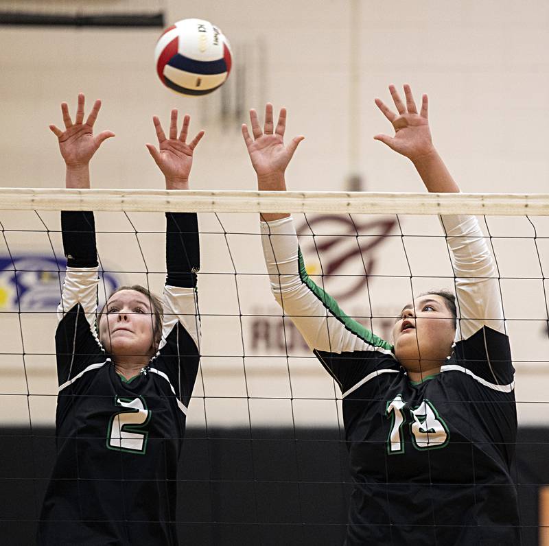 Rock Falls’ Kacie Witherow (left) and Ari Reyna go up for a block against Chicago Christian Friday, Nov. 3, 2023 in the class 2A volleyball supersectional in Sandwich.