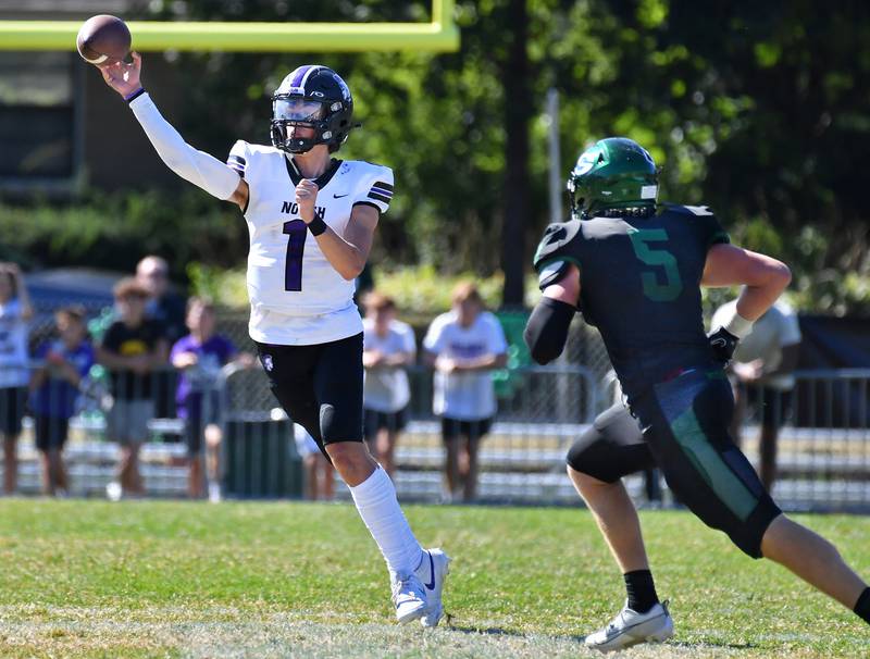 Downers Grove North quarterback Owen Lansu (1) releases a pass as Glenbard West's Ben Starmann (5) closes in during a game on Sep. 9, 2023 at Glenbard West High School in Glen Ellyn.
Jon Cunningham for Shaw Local News Network