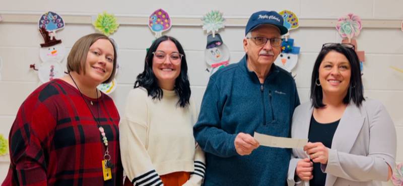Granville Knights of Columbus donated $2,013 to the Putnam County Schools from the Tootsie Roll fundraiser for the benefit of those with intellectual disabilities. Pictured are (from left) Michelle Erickson, special education teacher; Gianna Baracani, special education teacher; Doug Ossola, Knights of Columbus Tootsie Roll chairman; and Moriah Mott, principal.