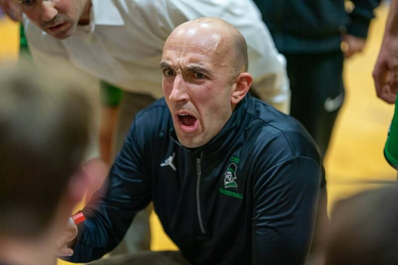 York's head coach Mike Dunn talks to his team between quarters during a basketball game against Downers Grove North at Downers Grove North High School on Friday, Dec 9, 2022.