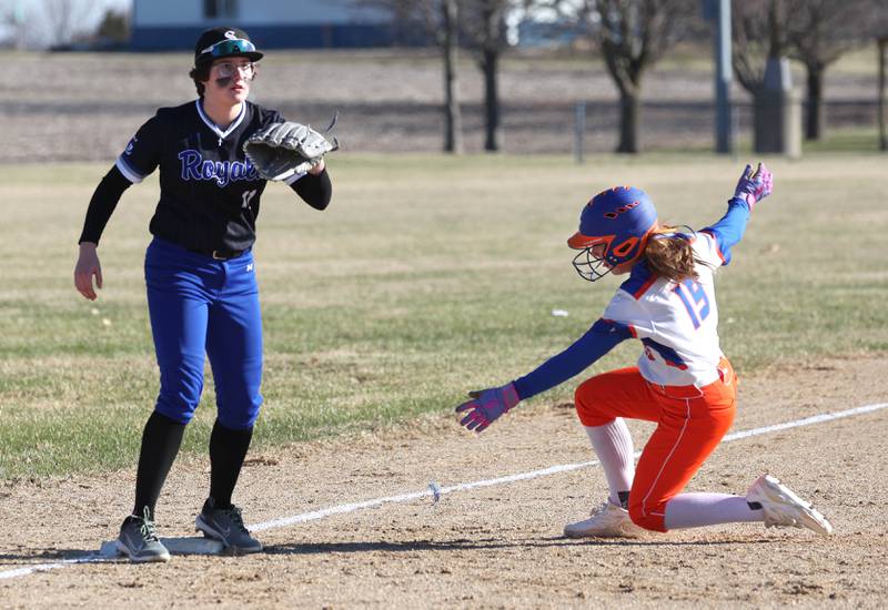 Genoa-Kingston's Kailey Haberkamp slides in safely at third as Hinckley-Big Rock's Grace Hall takes the throw Monday, March 23, 2026, during their game at Hinckley-Big Rock High School.