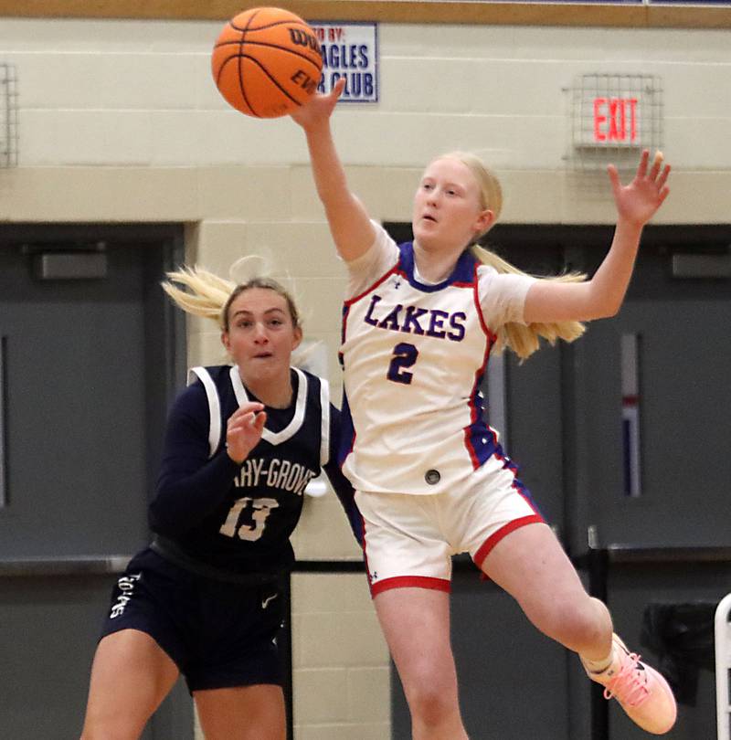 Cary-Grove’s Malaina Kurth, left, races Lakes’ Gianna Gray for the ball in varsity girls basketball action on Friday, Jan. 2, 2026  at Lakes High School in Lake Villa.