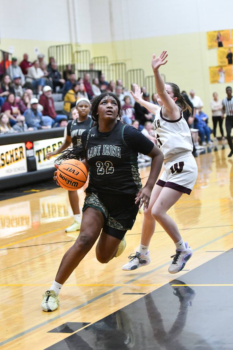 Bishop McNamara's Leigha Brown drives to the basket during the Fightin' Irish's 69-38 victory over Watseka-Milford in the IHSA Class 2A Herscher Sectional championship on Thursday, Feb. 27.