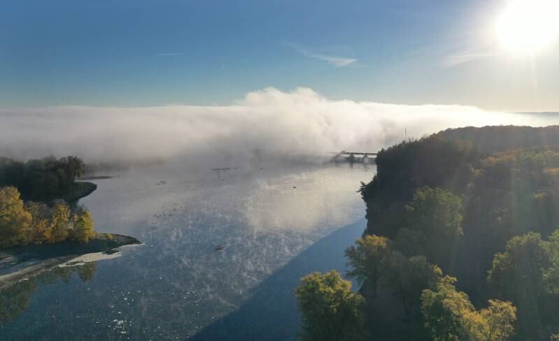 Fog begins to lift from the Illinois River near the Starved Rock Lock and Dam on Thursday, Oct. 24, 2024 in Starved Rock State Park.
