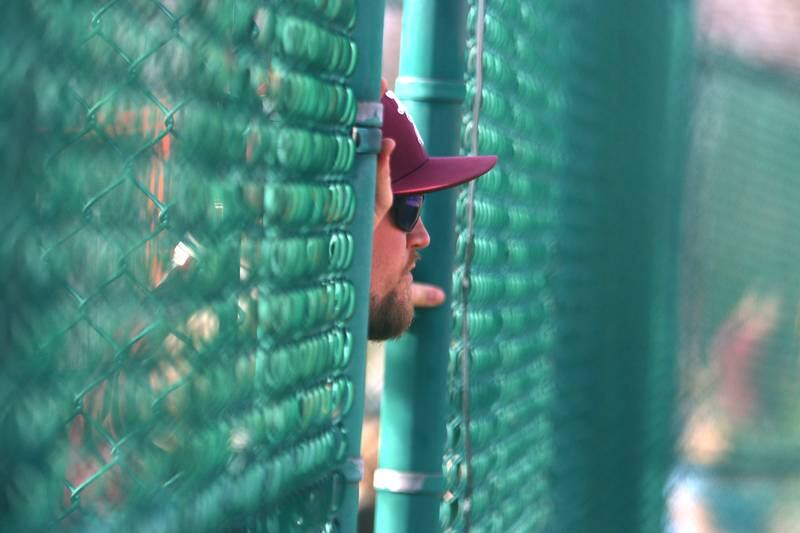 Richmond-Burton’s coach Tylar Stanton keeps his eyes on the action in varsity softball at Marengo Tuesday.