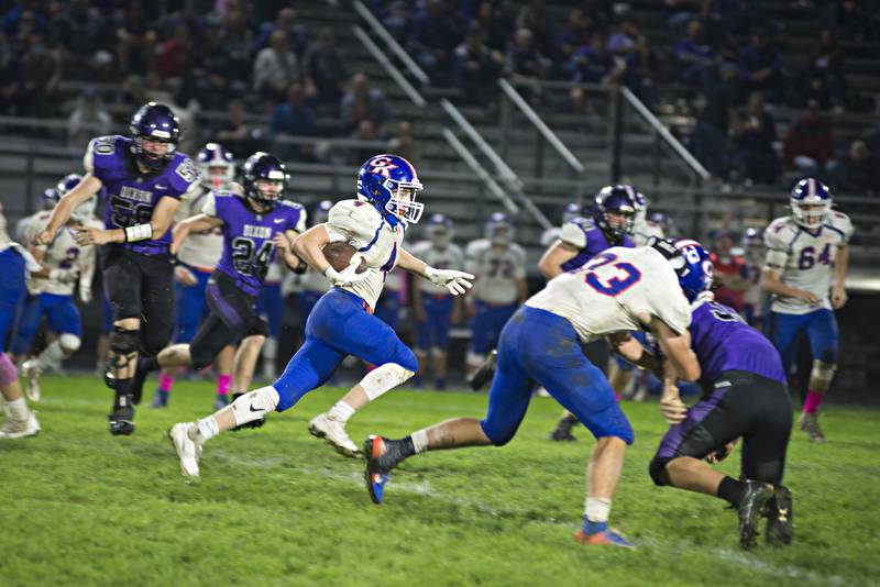 Genoa-Kingtson's Ethan Wilnau runs the ball back on a kick return for a touchdown in the second half against Dixon on Friday, Oct. 8, 2021.