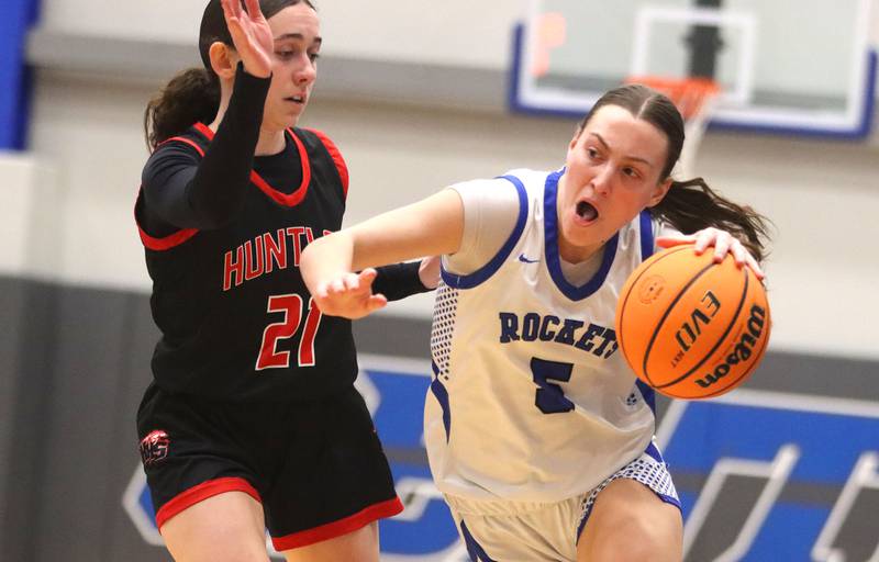 Burlington Central’s Audrey LaFleur works past Huntley’s Luca Garlin in varsity girls basketball on Monday, Feb. 9, 2026, at Central High School in Burlington.