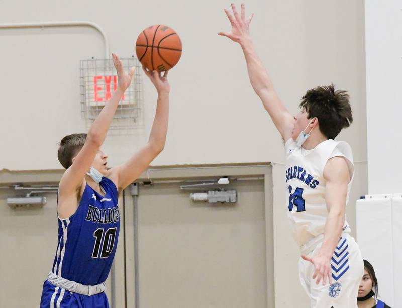 Riverside-Brookfield's Arius Alijosius (10) sinks a three point shot over St. Francis' Nikolas Rowlan (24) during a game in Wheaton on Tuesday, February 1, 2022.