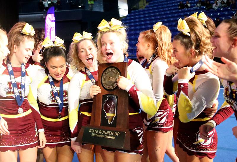 Members of the Richmond-Burton cheerleading team react after winning runner-up in the small team Competitive Cheerleading State Final Competition on Saturday, Feb. 3, 2024 at Grossinger Motors Arena in Bloomington.