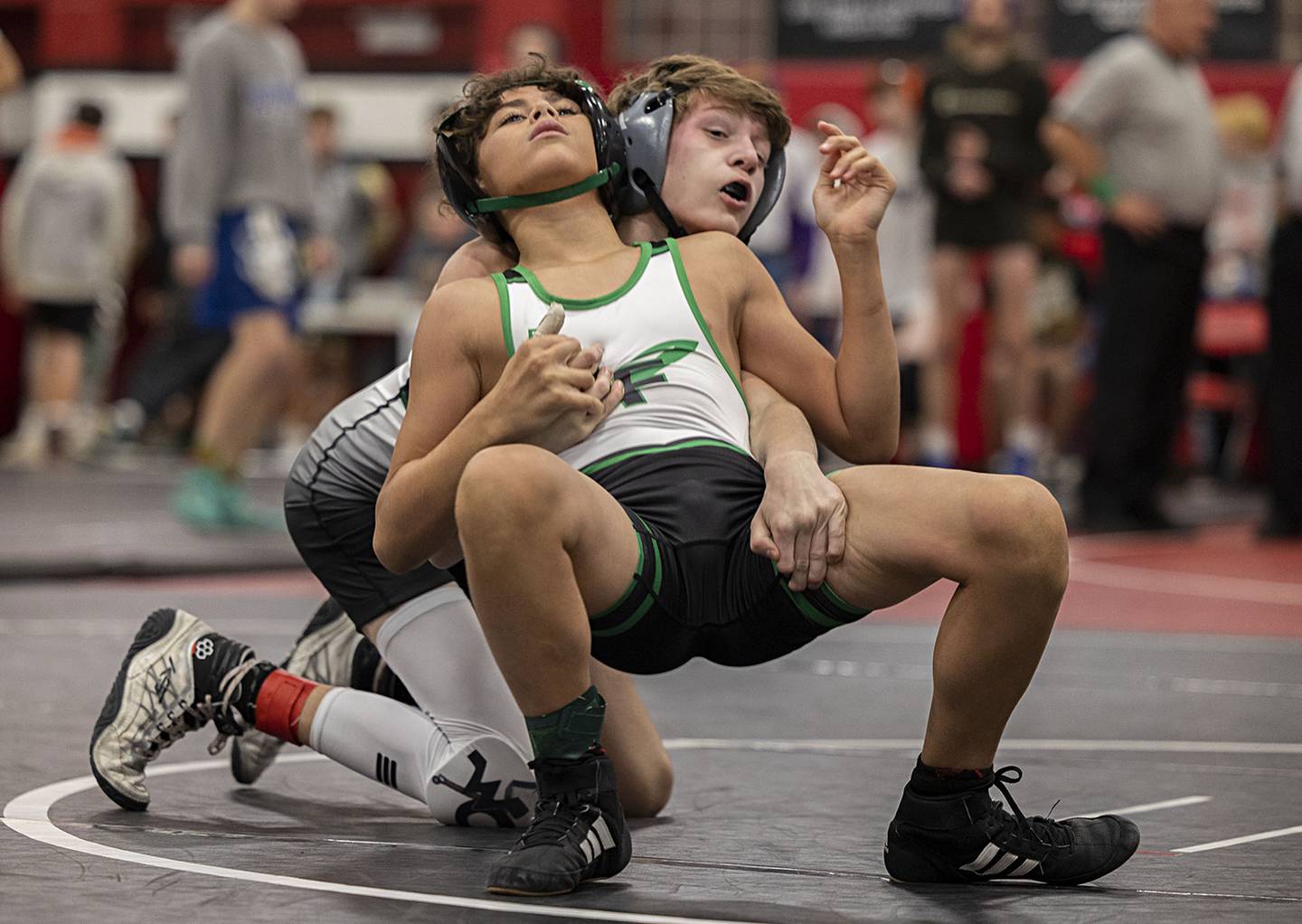 West Carroll’s Connor Knop (back) and Rock Falls’ Josiah Tarbill wrestle for the title at 106 pounds Saturday, Dec. 17, 2022 at the Erie-Prophetstown Holiday Tournament.