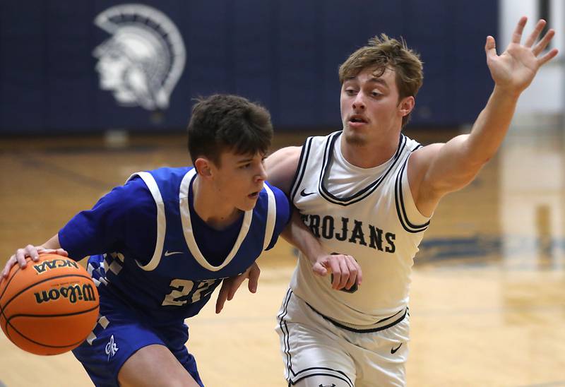 Burlington Central's Cash Cumpata tries to drive to the basket against Cary-Grove's Brandon Freund during a Fox Valley Conference  boys basketball game on Wednesday Jan. 7,  2026, at Cary-Grove High School, in Cary.