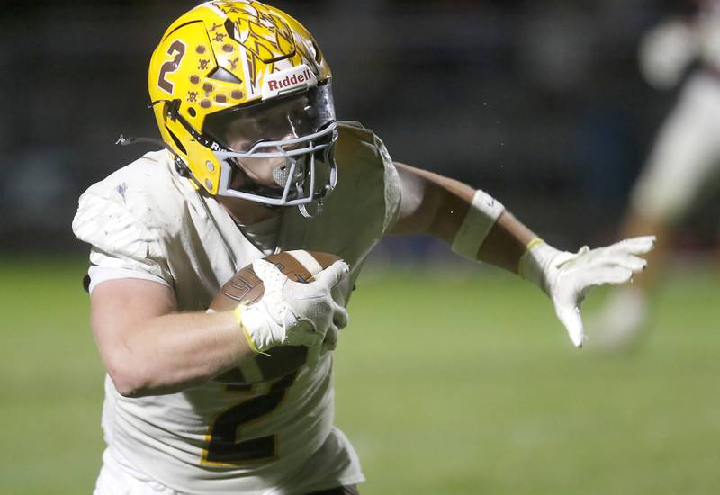 Prairie Ridge's Logan Thennes runs with the football during a Fox Valley Conference football game Prairie Ridge on Friday, Sept. 5, 2025, at Prairie Ridge High School in Crystal Lake.
