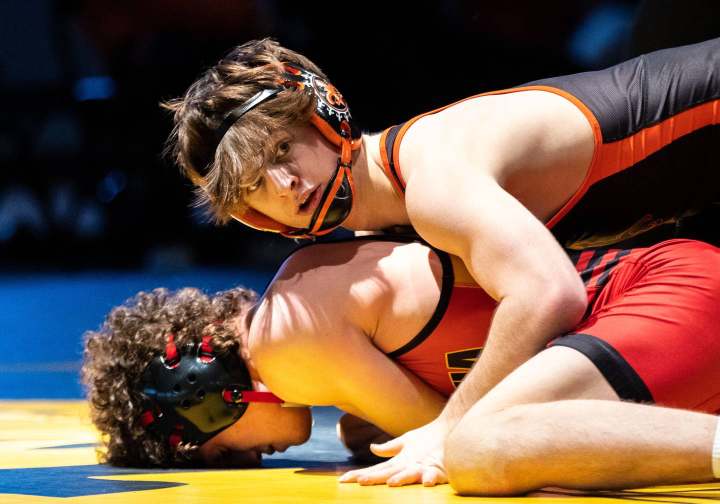 St. Charles East’s Dominic Munaretto takes down Batavia’s Kyle Pasco during a varsity wrestling dual at Batavia High School on Friday, Jan. 10, 2025. Munaretto won the match.