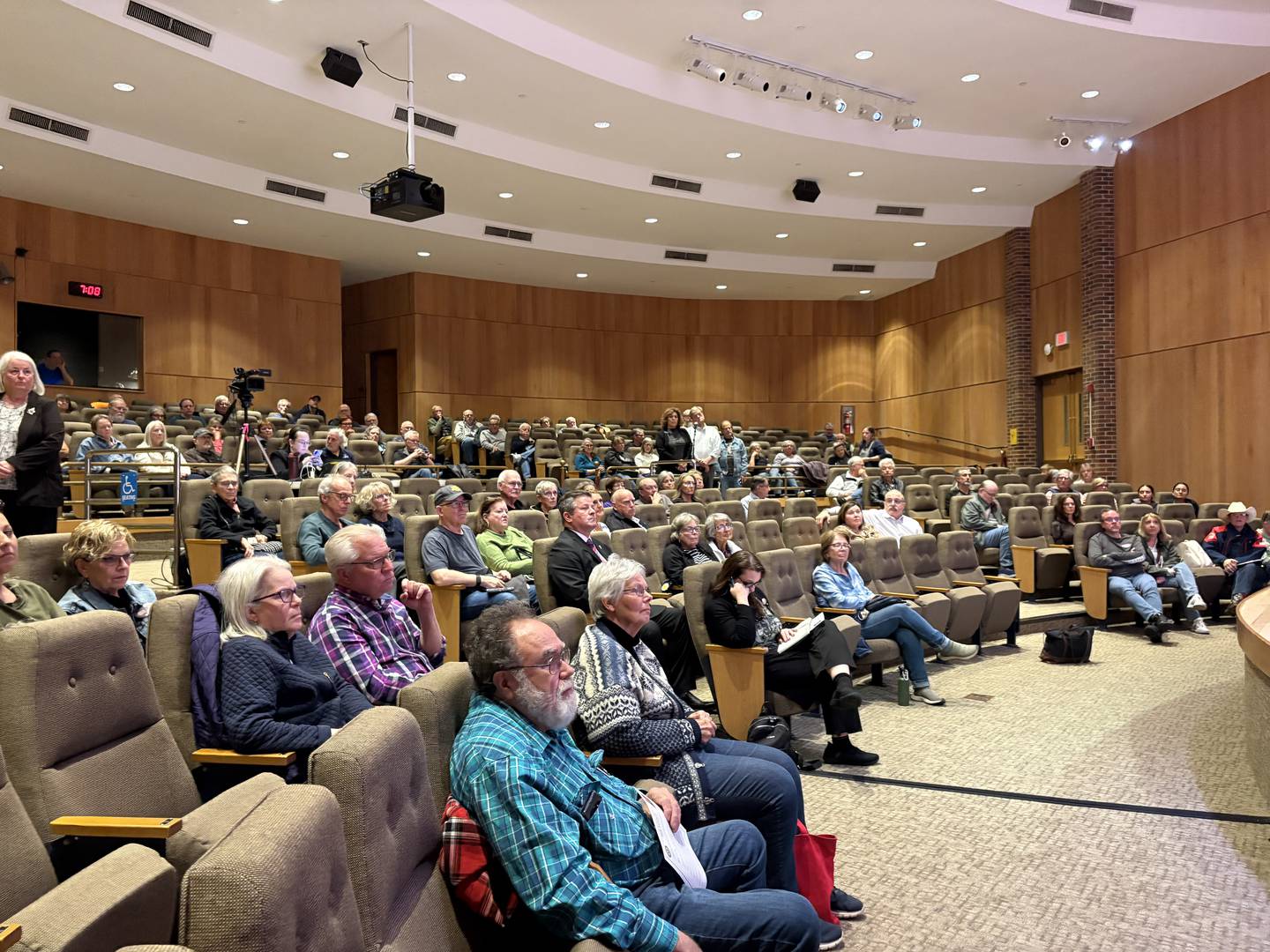 Audience members listen during a Bill Foster town hall in Crystal Lake April 8. 2026.