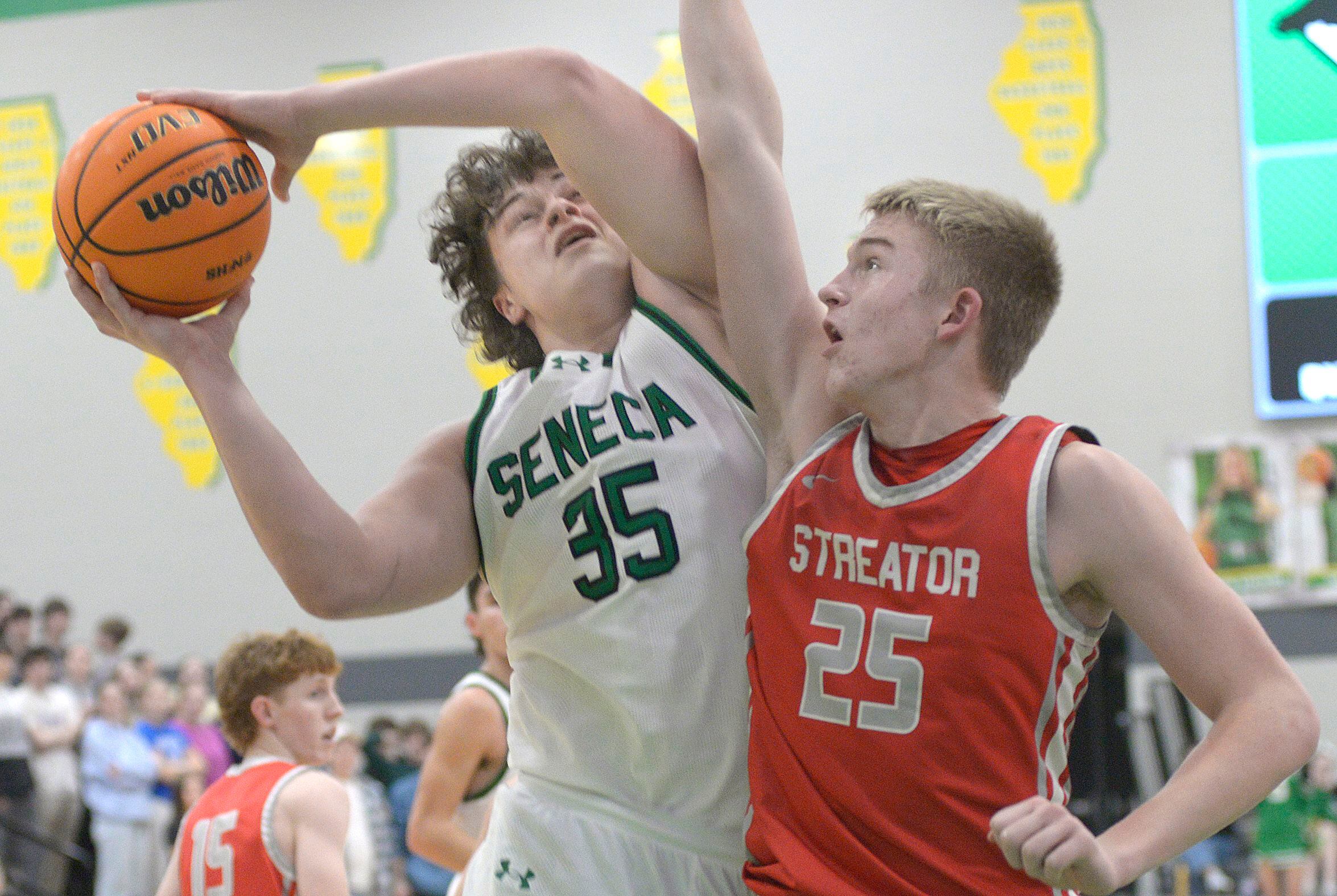 Streator’s Joseph Hoekstra attempts to block a shot by Seneca’s Zeb Maxwell in the second period Tuesday at Seneca.