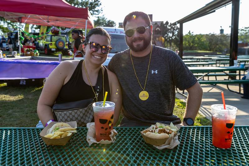Valerie and Brandon Leja enjoy gator tacos and cherry lime lemonade during New Orleans North Festival at Joliet Slammers Stadium on Aug. 15, 2025.