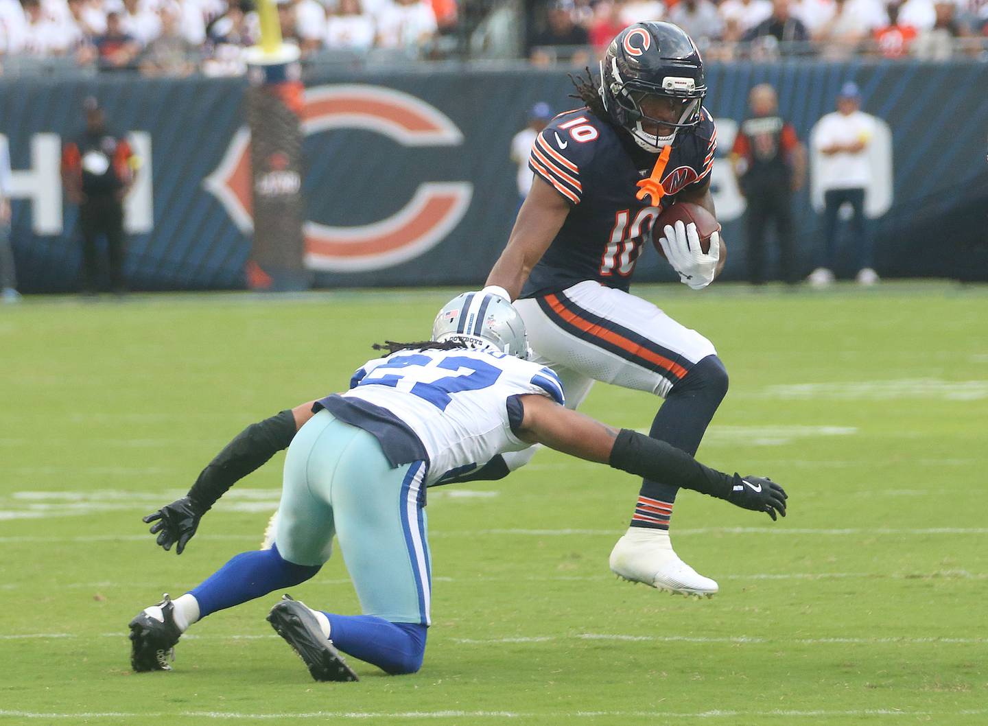 Chicago Bears Luther Burden III avoids the tackle by Dallas Cowboys safety Reddy Steward on Sunday, Sept. 21, 2025 at Soldier Field.