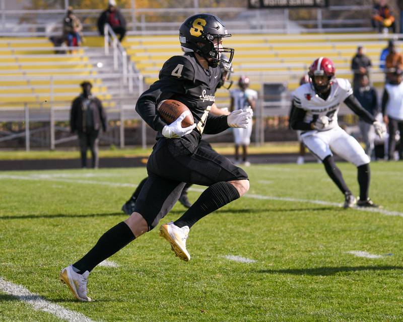 Sycamore's Aidan Wyzard (4) runs the ball during the class 5A playoff game on Saturday Nov. 2, 2024, while taking on Chicago Bulls College Prep at Sycamore High School.